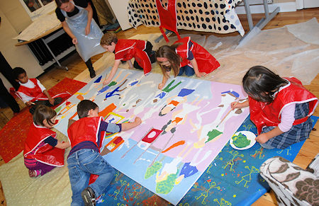 Art lesson children creating a mural